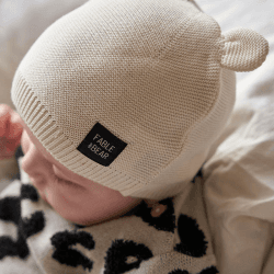 Image showing the Ear-Resistible Knitted Hat, 0 - 6 Months, Natural White product.